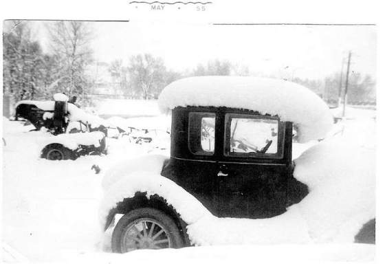 Model T Ford Coupe buried in snow, Canada 1955